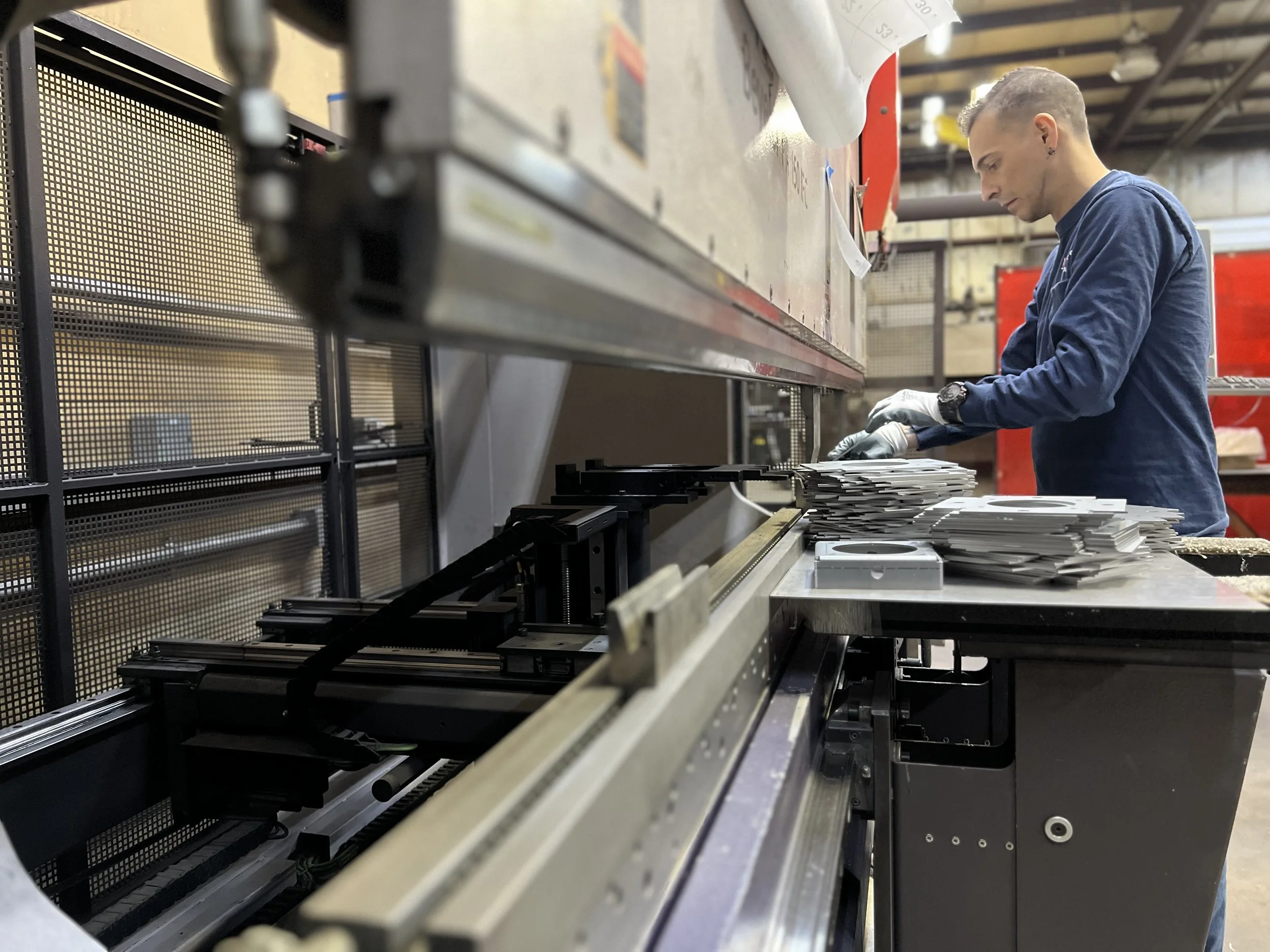 Technician inspecting machinery during a quality check