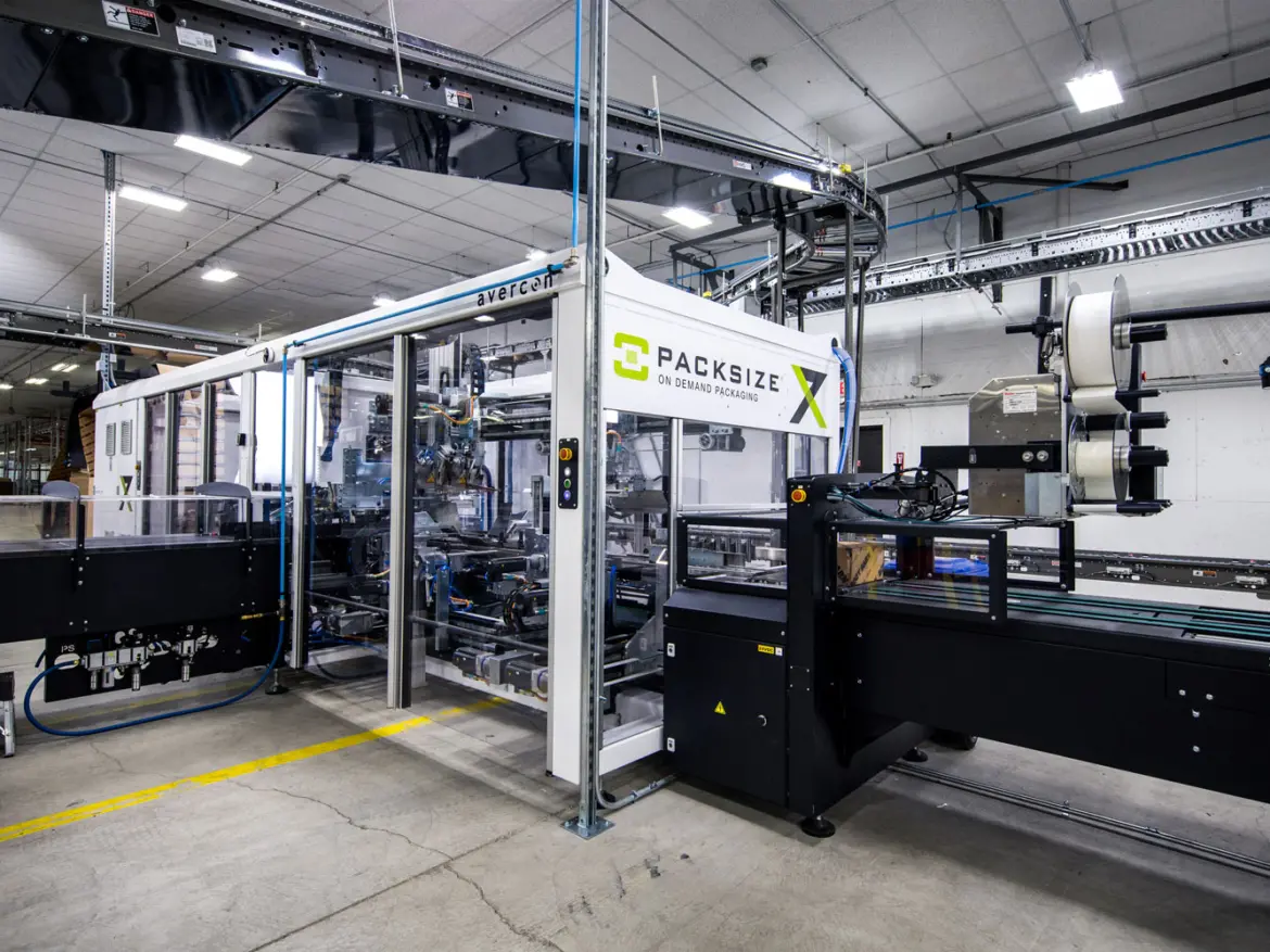 Automated packaging line with cartons moving along conveyors